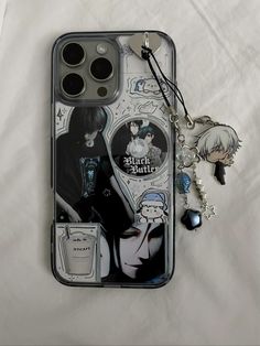 a cell phone case with an image of two people and a keychain on it