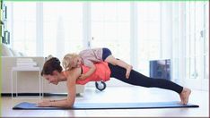 a woman and child are doing yoga together