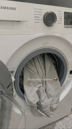 a white washing machine with its door open