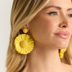 Wildflowers grow wherever they are regardless of the environment around them. All of us are wildflowers and are capable of thriving wherever we are in life or what's going on around us. The Wildflowers Statement Earrings are made of bright raffia and gold hardware. Handmade by Female Artisans Hypoallergenic Length: 3 inches Width: 2.25 inches Handmade with Raffia & Thread Lightweight for everyday wear! Handmade Flower Earrings Adjustable For Spring, Unique Yellow Earrings For Party, Unique Yellow Earrings For Summer, Yellow Spring Earrings, Yellow Flower Charm Earrings For Summer, Luxury Statement Yellow Earrings, Yellow Handmade Flower Earrings, Vibrant Yellow Earrings For Beach, Yellow Flower Charm Earrings For Spring