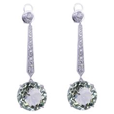 Green Amethyst Brilliant Cut Round Prasiolite Diamond Drop Line Unique Statement Classic Timeless 18K White Gold Dangle Earrings 18 Karat White Gold Genuine Green Amethyst/Prasiolites & Diamonds 16.71 CT Green Amethyst Gemstones 0.53 CTW Diamonds Beautiful light green color - almost transparent in brilliance with hints of slight light green hues of forests, fields & mints. Some have commented that these stones remind them of the Mediterranean Sea of Greece & Balkan coasts. Extremely aqua teal green. Stunning pair of earrings crafted in white gold for a classic, timeless look & ready-to-wear for any occasion, especially for evening & formal wear. Gold Dangle Earrings, Green Hues, Evening Formal, White Gold Earrings, Earring Crafts, Diamond Drops, Mediterranean Sea, Green Amethyst, Gold Earrings Dangle