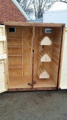 the inside of a wooden shed with shelves in it