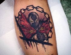 a man's arm with a tattoo on it and an image of a demon