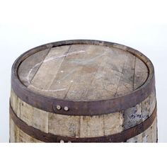 an old wooden barrel sitting on top of a table