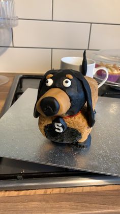 a cake shaped like a dog sitting on top of a counter