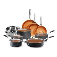 an assortment of pots and pans on a white background with the lids off,