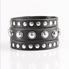 Win Your Spurs - Black Round And Flat Silver Studs Are Studded Across The Front Of A Thick Black Leather Band That Has Been Spliced Into Three Bands. Features An Adjustable Snap Closure. Sold As One Individual Bracelet. Trendy Black Bracelets With Rivets, Silver Leather Punk Bracelet With Black Band, Punk Style Silver Leather Bracelet With Black Band, Silver Leather Bracelet With Black Band In Punk Style, Black Leather Bracelets With Studs, Black Leather Jewelry With Studs, Black Trendy Bracelets With Studs, Trendy Black Bracelets With Studs, Black Leather Punk Bracelet With Silver Studs