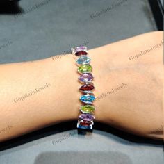 Natural Multi Gemstone Bracelet, 925 Sterling Bracelet, 5x10mm Marquise Cut Gemstone Bracelet, Multi Color Tennis Bracelet, Wedding Gift, Anniversary Gift, Women's Jewelry ★ PRODUCT DETAILS ★ * SKU - BST-309-MT * Product - Bracelet * Metal - Sterling Silver * Metal Purity - 925 * Total Weight - 11.17 GMS (Approx.) ★ STONE DETAILS ★ * Stone Name - Multi Stone * Stone Size - 5x10mm * Stone Shape - Marquise  * Stone Color - Multi * Stone Weight - 20.50 CTS (Approx.)  * Stone Cut - Faceted ★ Click H Oval Gemstone Bracelets For Anniversary, Oval Sterling Silver Bracelets With Multi-stone, Sterling Silver Oval Gemstone Bracelet For Anniversary, Oval Sterling Silver Bracelet With Gemstone For Anniversary, Silver Multi-stone Tennis Bracelet, Sterling Silver Multicolor Bracelets For Anniversary, Multicolor Sterling Silver Bracelet For Anniversary, Multicolor Sterling Silver Anniversary Bracelet, Sterling Silver Oval Bracelet For Anniversary