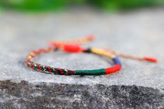 Multicolored bracelets with lucky Buddhist Tibetan knots, handcrafted according to Buddhist tradition ✿ History ✿ The Buddhist tradition of these very special bracelets has its origin in Buddhist temples, where Tibetan monks perform each knot while reciting mantras that infuse intention. Full awareness in this meditative act achieves that the high vibration is transmitted to the bracelets and attract luck and the most positive things to our lives. Their popularity causes them to be chosen by fam Traditional Hand Wrapped Bracelets As Gift, Traditional Hand Wrapped Bracelets For Gifts, Traditional Handmade Bracelets For Good Luck, Handmade Braided Bracelets For Festivals Gift, Artisan Braided Bracelet Gift, Handmade Braided Bracelets For Good Luck, Traditional Beaded Friendship Bracelets, Traditional Braided Bracelets For Gifts, Traditional Braided Bracelets As Gifts