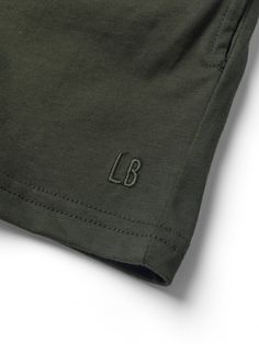 Whether they're an athlete or they just play hard all day, your little needs our Gym Short. With lightweight, breathable fabric, these shorts are a staple piece for your active little. Pair them with our LB Collegiate Crewneck for the complete Gym Collection look! Color: Forest Rollable elastic waistband Functional sewn-in drawstring Relaxed fit Two front pockets + one back pocket Printed inner tag Signature embroidered 'LB' Material + Wash: 100% cotton Do not bleach Machine wash cold with like Play Hard, Staple Pieces, Breathable Fabric, Relaxed Fit, Fabric