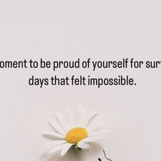 a daisy sitting on top of a white table next to a quote that says, moment to be proud of yourself for sure days that felt impossible