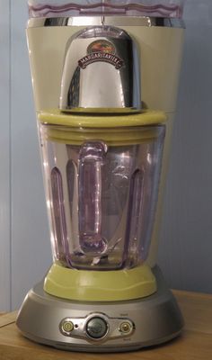 a blender sitting on top of a wooden table