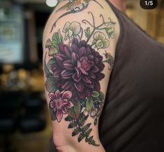 a person with a flower tattoo on their arm