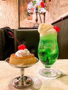 two desserts sitting on top of a table next to each other