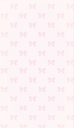 a pink wallpaper with bows on it