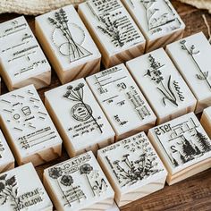 several rubber stamps sitting on top of a wooden table