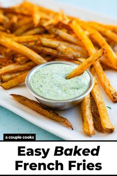 french fries on a white plate with a small bowl of dip in the middle and text overlay that reads easy baked french fries