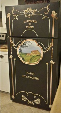 an old fashioned refrigerator is painted black with gold trimmings and the words paris etrangrs on it