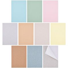 six different colors of fabric with white paper in the middle and one light blue, pink,