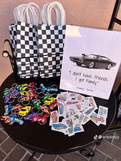 a table topped with lots of toys and greeting cards on top of a black table