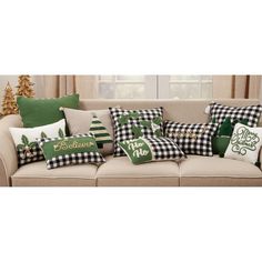 a couch with pillows and christmas decorations on it