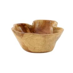 a wooden bowl sitting on top of a white surface