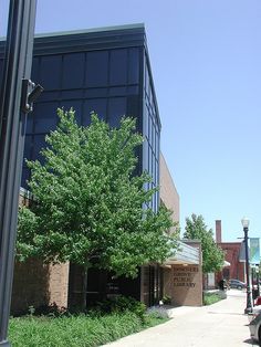 a tree is growing in front of a building