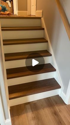 an image of a stair case with wood treading on the bottom and side steps