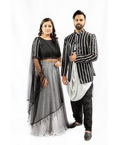 BLACK, RAW SILK BLOUSE WITH ELBOW LENGTH SLEEVE WITH SEQUIN AND GREY LEATHER POLK A DOT. BLACK TASSELS ALONG BLOUSE HEM AND BACK BUTTONS. GREY, NET LEHENGA WITH TEXURED PATTERN. SKIRT STYLE: HIGH WAIST, FULL LENGTH, CIRCLE SKIRT WITH SIDE POCKETS AND BACK ZIPPER. MATCHING OPTION: KING OF AURANGABAD Raw Silk Blouse, Pattern Skirt, Net Lehenga, Hem Blouse, Cotton Kurta, Skirt Style, Silk Pants, Elbow Length Sleeve, Circle Skirt