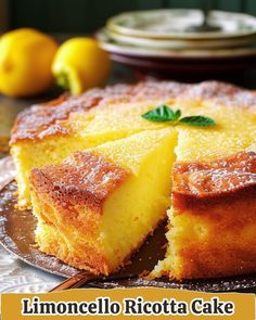 a lemon ricotta cake on a plate with the words limoonello ricotta cake