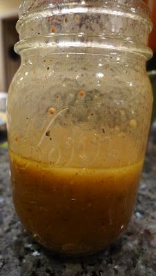 a jar filled with liquid sitting on top of a counter