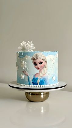 a frozen princess cake with frosting on top