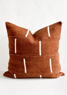 A mudcloth throw pillow in rust with white vertical line motif. Modern Textiles Patterns, Mudcloth Decor, Block Printed Pillows, Mudcloth Pillow, Textile Pattern Design, African Textiles, Modern Throw Pillows, Pillows And Throws, Perfect Pillow