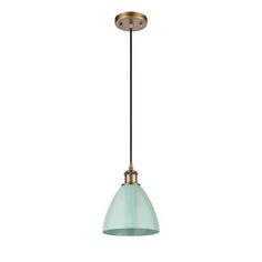 a brass and glass pendant light with a green shade on the bottom, against a white background