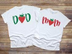 two white shirts with strawberries on them that say mom and son in red letters