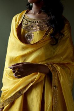 Mango yellow kurta featuring hand embroidery with gota, thread, and sequin detailing along the neckline and an asymmetric hem. Paired with a bandhani dhoti pant and dupatta., Fit: Relaxed Embroidery Neckline, Mango Yellow, Yellow Kurta, Dhoti Pants, Yellow Silk, Embroidered Neckline, Women Kurta, Fabric Silk, Embroidered Silk