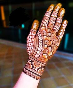 a hand that has some henna on it