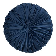 a blue round pillow on a white background