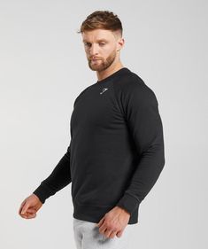 REST DAY THE CREST WAY Rest day the Crest way in the consistently comfortable and casually stylish Crest Sweatshirt. A versatile look, you can wear it anywhere and pair it with anything, with ribbed cuffs for a clean fit and a durable embroidered logo to keep it looking fresh no matter how many times you wear it. And, thanks to its cotton-polyester build and warm, incredibly soft interior, this sweatshirt is both comfy and reliable, so you can combine relaxation and recreation with ease. - Slim fit- Raglan sleeves- Ribbed hem and cuffs for a clean fit- Durable embroidered Gymshark logo- Soft, brushed back fabric inside- 80% Cotton, 20% Polyester- Model is 6'0" and wears size M- SKU: A2A1V-BBBB Cotton Long Sleeve Everyday Activewear, Black Crew Neck Sweats For Gym, Long Sleeve Gym Tops With Ribbed Cuffs, Cotton Activewear With Ribbed Waistband And Long Sleeves, Cotton Long Sleeve Activewear With Ribbed Waistband, Long Sleeve Gym Sweatshirt With Ribbed Cuffs, Long Sleeve Sweats With Ribbed Cuffs For Gym, Casual Black Top With Ribbed Waistband, Everyday Black Sweats With Ribbed Cuffs