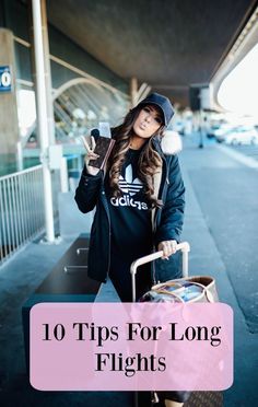 a woman is holding her luggage and smiling at the camera with text overlay that reads 10 tips for long flights