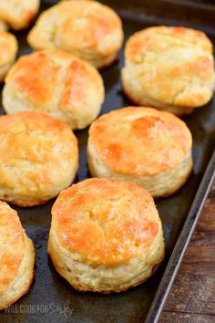 some biscuits are sitting on a baking sheet and ready to be baked in the oven