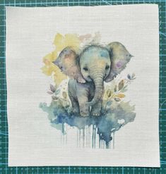 an elephant painted on top of a piece of cloth