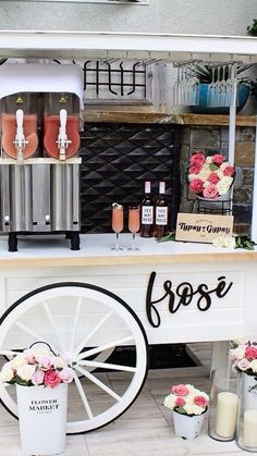 an ice cream cart is decorated with flowers and candles