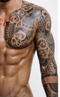 a man with tattoos on his chest