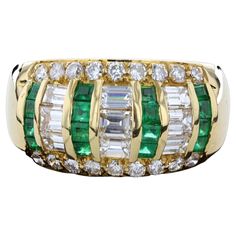 The ring is set with lovely square cut emeralds that weigh approximately 0.60ct. and round cut diamonds that weigh approximately 1.48ct. The color of these diamonds is G-H with VS1 clarity. The ring has a tapering width from 4.5mm to 11mm. The ring is stamped K18 and weighs 10 grams. The ring is size 7. Square Cut, The Ring, Round Cut Diamond, Round Cut, Band Rings, Diamond Ring, Emerald, Jewelry Rings, Stamp