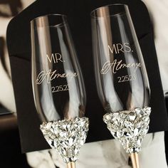 two wine glasses with the names mr and mrs on them, sitting next to each other