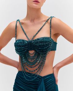 The Hand-Beaded Bralette was part of the Fall 2024 Runway Collection. Crafted from a tulle fabric, this bralette is fully beaded with green tonal beads and features a dramatic hand-beaded drape detail. The straps are beaded and adjustable. Back clasp closure.Made in Brazil. TOP30393US. Beaded Bralette, Bra Art, Bead Bra, 2024 Runway, Diy Wings, Beaded Top, Tulle Fabric, Runway Collection, Made In Brazil