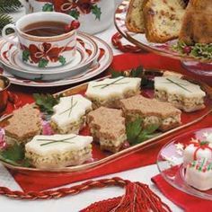 a table topped with plates and cups filled with desserts