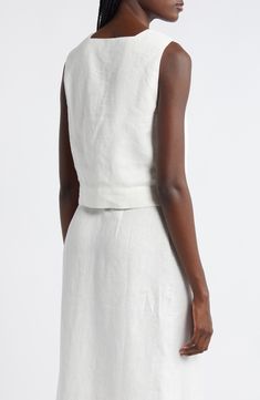 This lightweight linen tank top features a modern square neck, wide shoulder straps and a cropped hem. 18 1/2" center front length (size Medium) Square neck 100% linen Dry clean Imported Fitted Linen Tank Top For Spring, Fitted Linen Sleeveless Crop Top, Fitted Sleeveless Linen Crop Top, Fitted Linen Elegant Crop Top, Chic Sleeveless Linen Crop Top, White Linen Square Neck Top, White Sleeveless Linen Crop Top, Elegant White Linen Tank Top, White Fitted Linen Crop Top