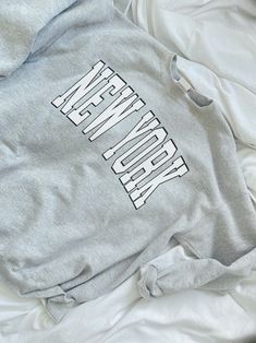 .: 50% Cotton 50% Polyester .: Medium-heavy fabric (8.0 oz/yd² (271.25 g/m²)).: Loose fit.: Sewn in label.: Runs true to size Gray Crew Neck Top With Letter Print, Cotton Stretch Sweatshirt With Letter Print, Cotton Sweats With Text Print And Relaxed Fit, Cotton Sweats With Letter Print For Everyday, Cotton Relaxed Fit Sweats With Text Print, Cotton Stretch Sweatshirt With Graphic Print, Relaxed Fit Cotton Sweats With Text Print, Cotton Crew Sweats With Letter Print, Basic Cotton Sweatshirt With Letter Print